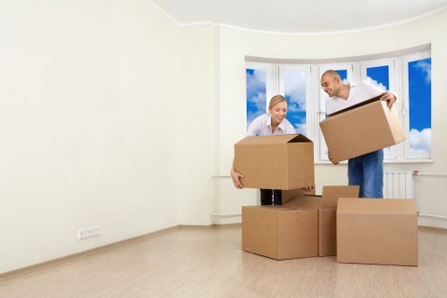 Commercial moving team handling desks and equipment