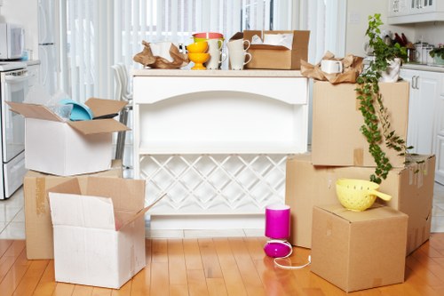 People preparing boxes for a Brent movers service