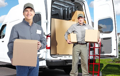 Packing boxes and furniture ready for a Brent move