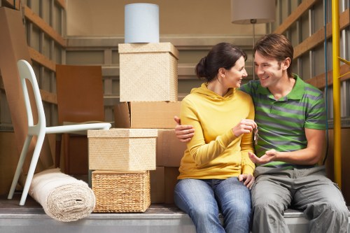 Professional movers handling heavy furniture carefully