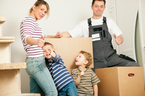 Local movers handling office equipment with care during a Brent relocation